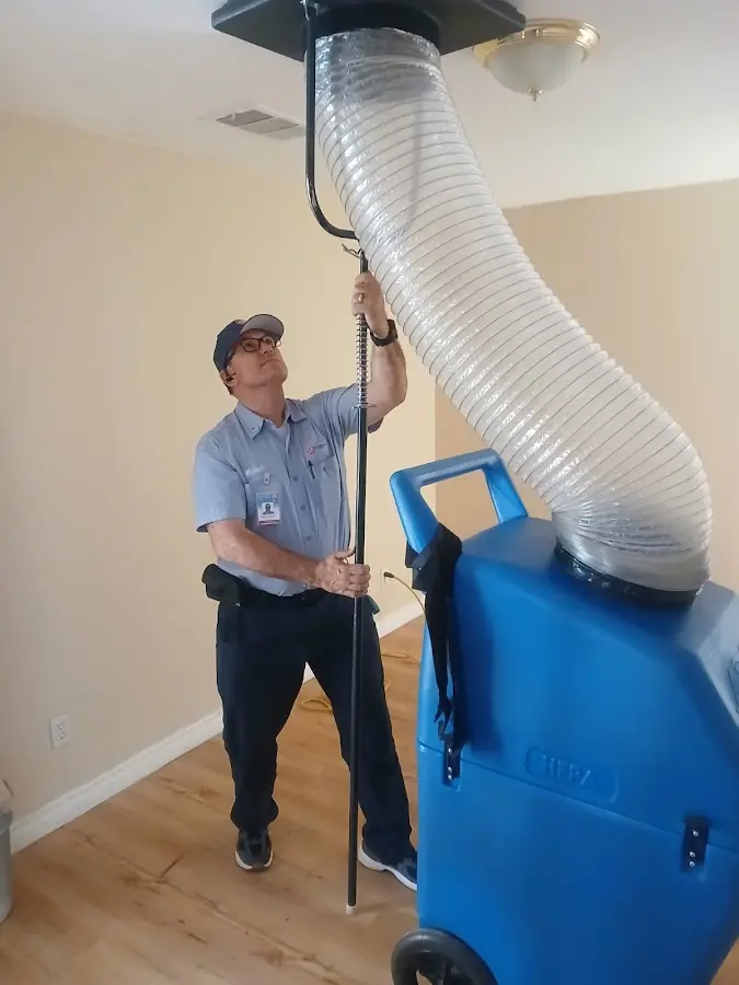 Furnace Tune-Up technician using HEPA equipment in Yuba City